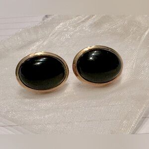 Black onyx cabochon ovals set in 14k gold frame earrings